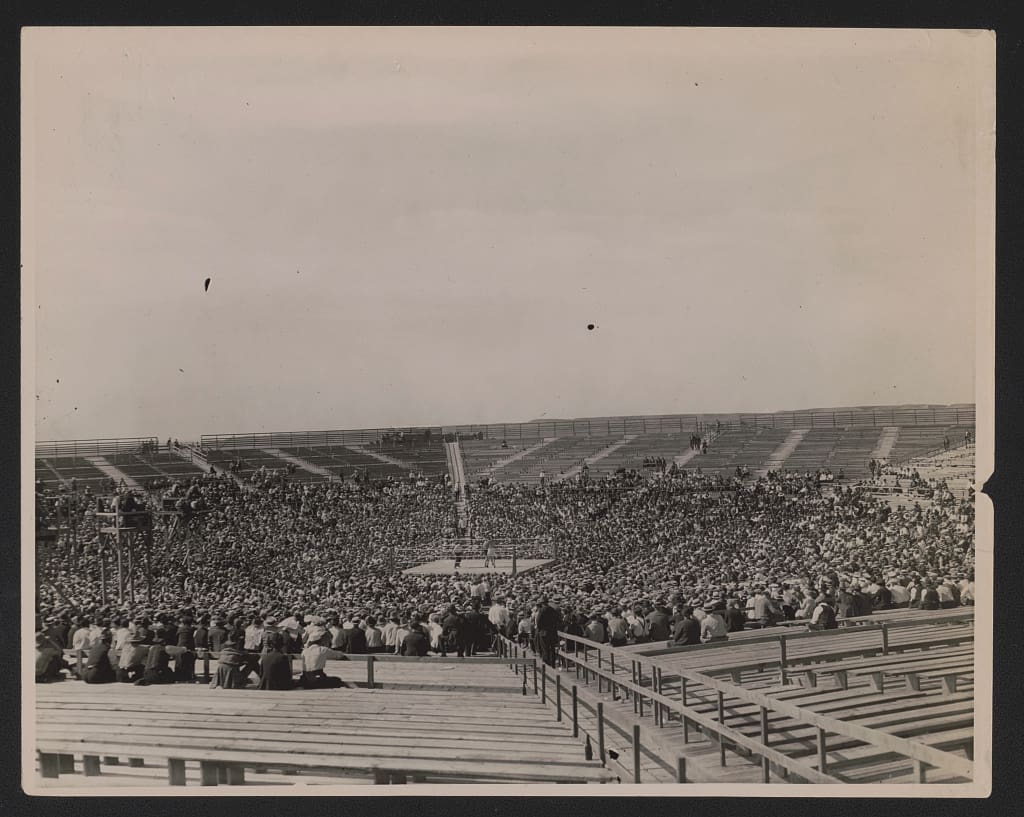 Stadium and crowd at boxing match between Jack Dempsey and Tommy Gibbons